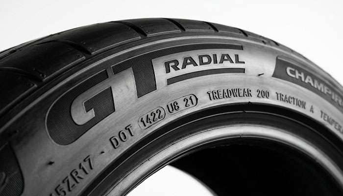 Close-up of a GT Radial Champiro SX2 tire sidewall showing the DOT code and the UTQG 200 A A marking