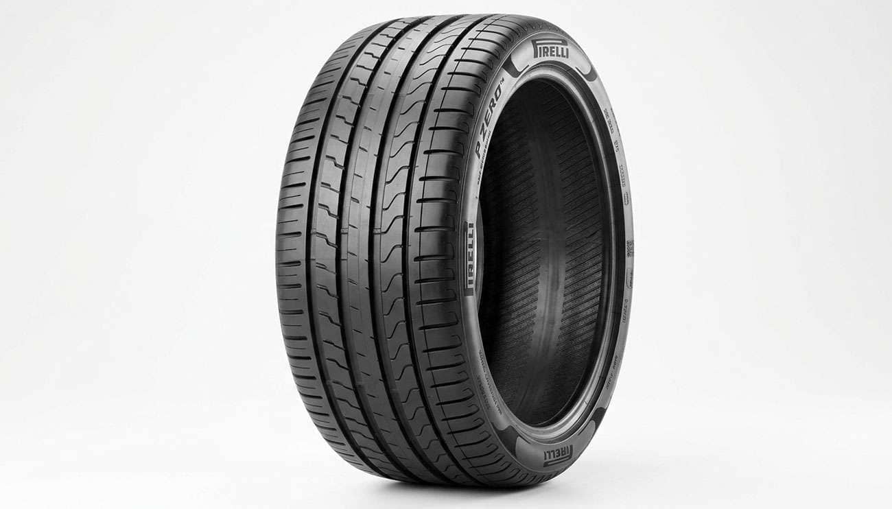 Pirelli P Zero PZ4 max performance summer tire with raised PIRELLI lettering on the sidewall shown on a clean white seamless backdrop