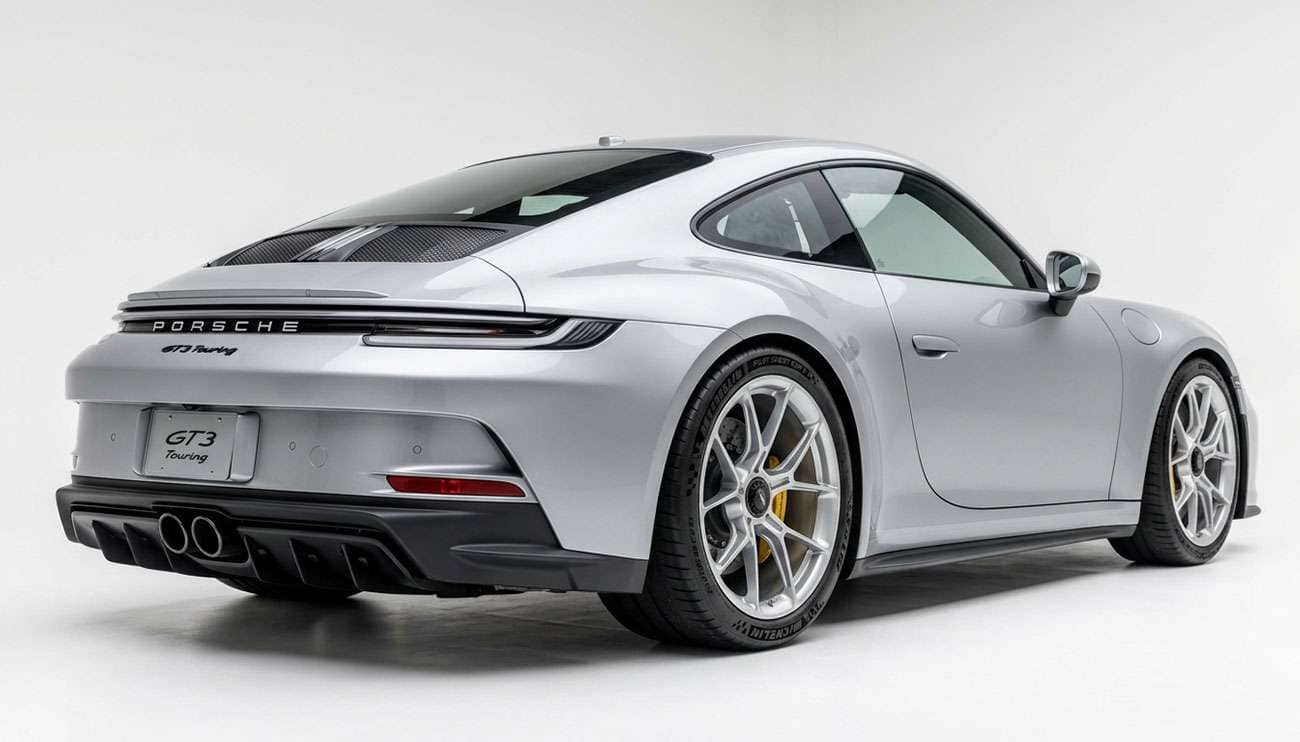 Rear three-quarter view of a Porsche 911 on staggered N-rated summer performance tires