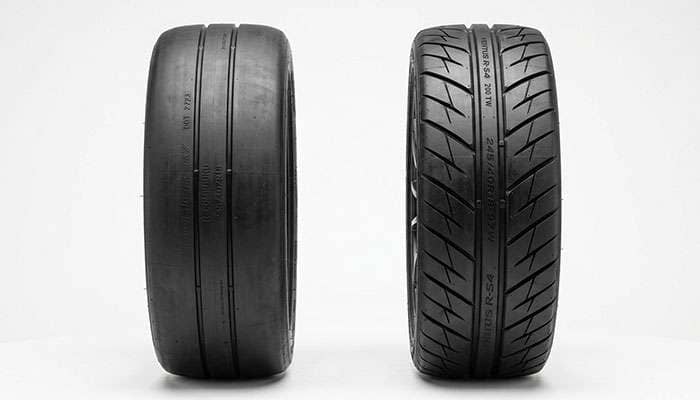 Side-by-side comparison of a semi-slick R-compound tread next to a more grooved 200 treadwear extreme performance tire tread on a clean white studio backdrop