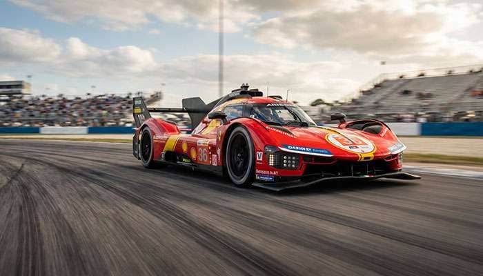 Race car on a race track with tire tracks visible, demonstrating high-speed performance testing