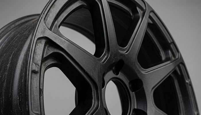Racing-derived wheel construction detail showing engineering callouts