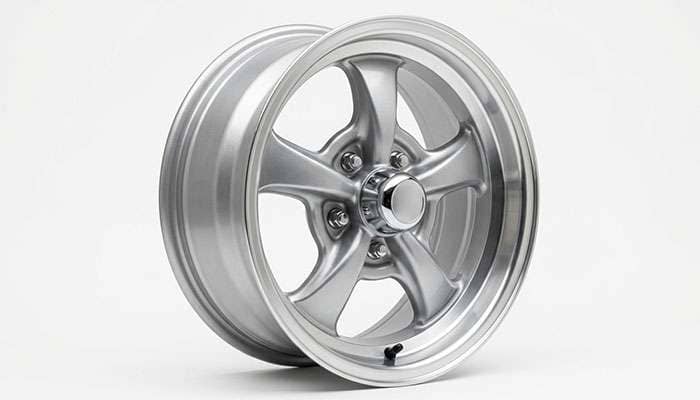 Quarter view of Pontiac Rally II reproduction wheel showing aero center cap detail