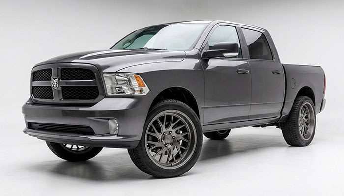 Brown Dodge Ram 1500 pickup truck parked in front of a concrete wall with text about wheel fitment above