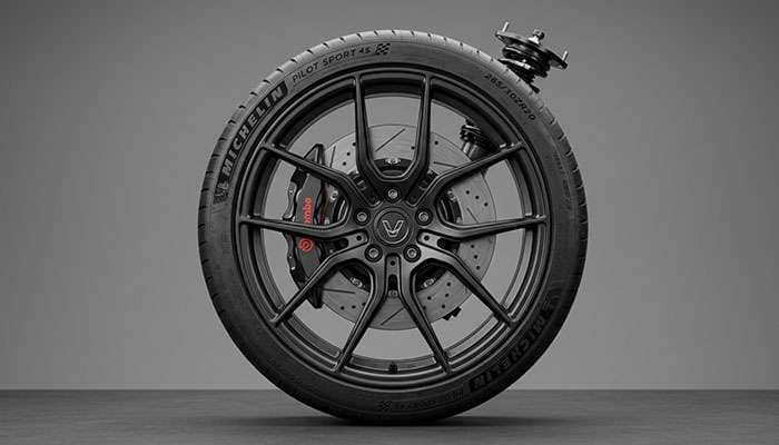 Restomod chassis showing modern suspension components with wheel and tire package and big brake kit fitment visible