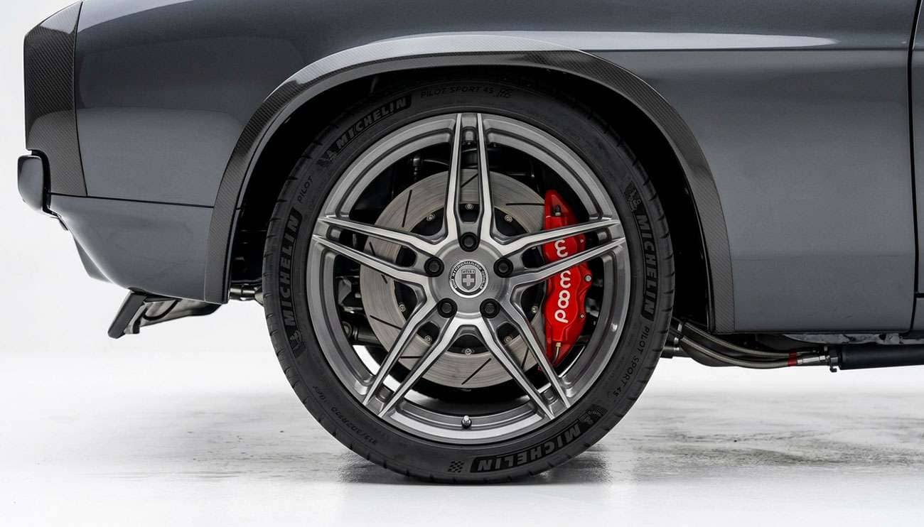 Restomod classic muscle car with modern forged wheels and large performance brakes visible behind the spokes