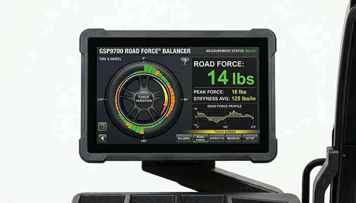Road force balancer display screen showing road force variation measurement in pounds