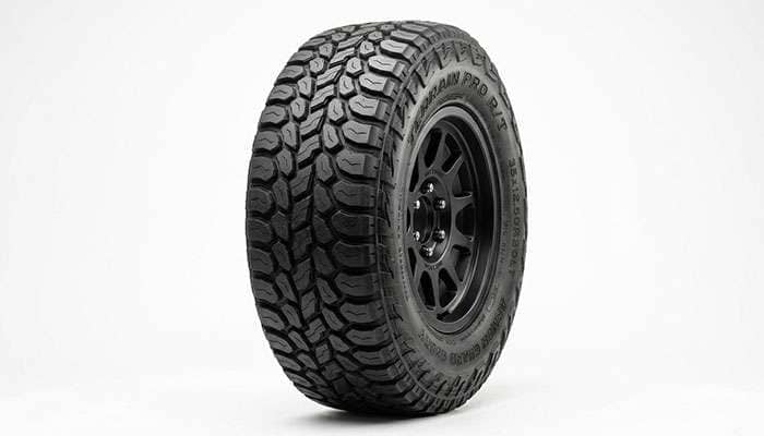 Rugged-terrain hybrid tire photographed in a studio