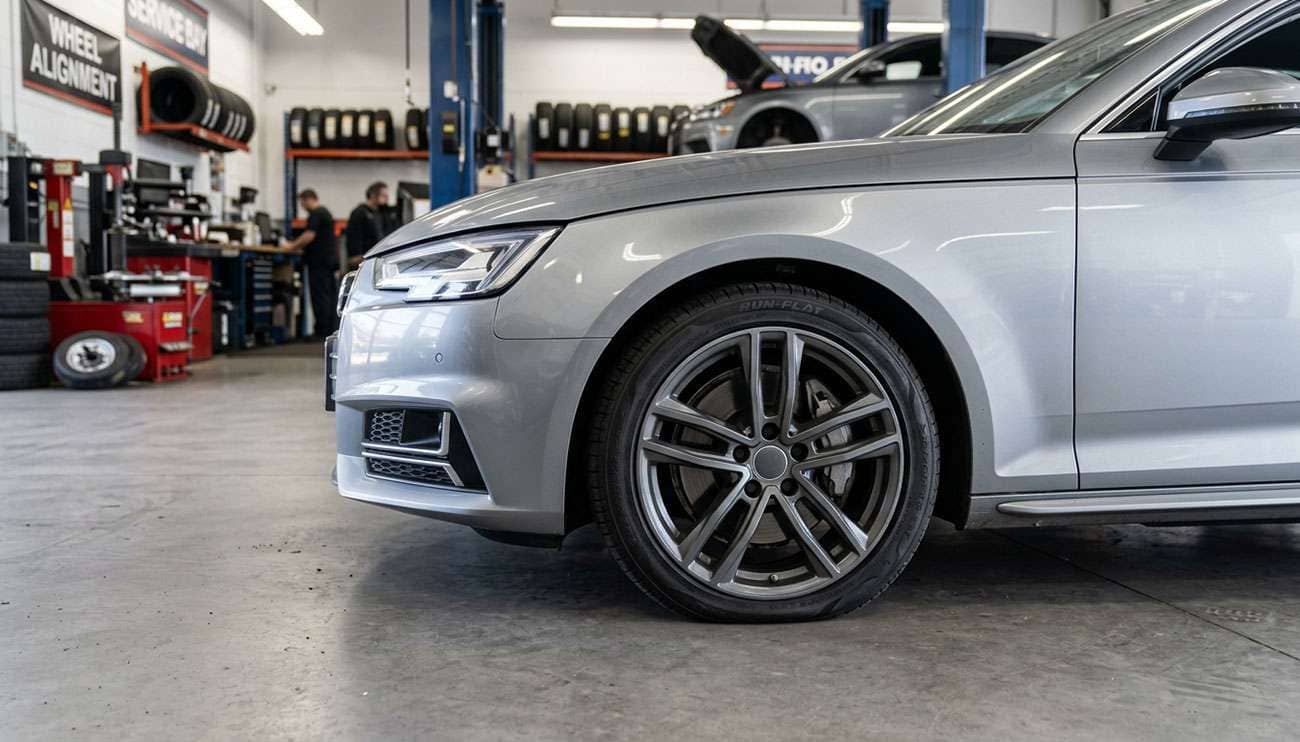 Luxury sedan with run-flat tire showing reinforced sidewall construction in detail