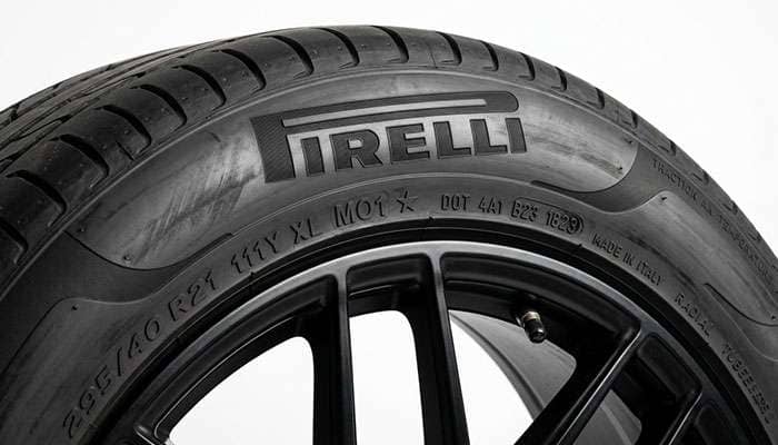 Close-up of a Pirelli Scorpion Verde sidewall showing raised PIRELLI lettering and embossed size and approval markings