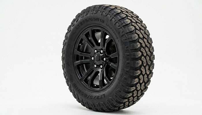 Close-up of an LT275/65R18 Load Range C mud-terrain tire sidewall on a lifted Silverado Trail Boss