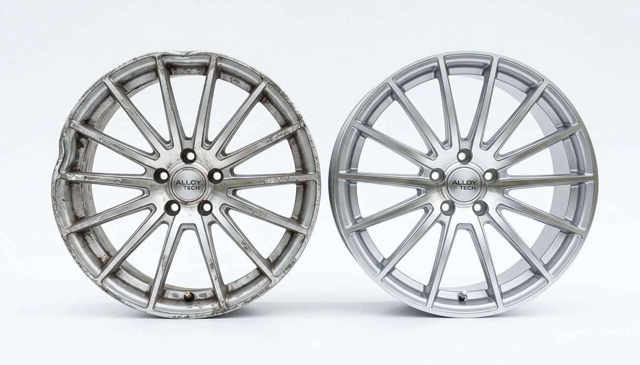 Bent alloy wheel with a damaged lip next to a new matching replacement wheel