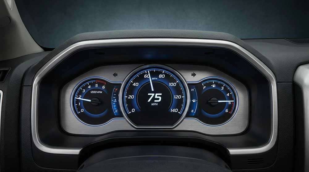 Comparison of vehicle speed by RPM across transmission gears for two scenarios with different tire diameters and differential ratios