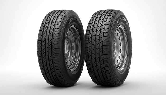 Comparison of Free Country trailer tires showing deeper and wider tread with 30% more tread life than other brands