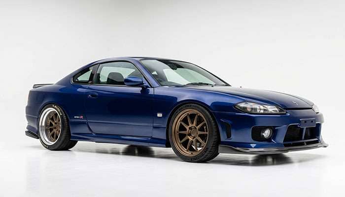 Rear-drive performance car fitted with a staggered deep dish wheel setup
