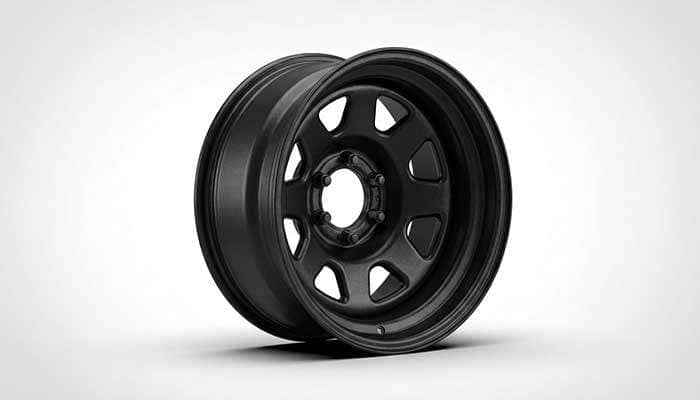 Black steel truck wheel with classic design showing durable carbon-iron construction