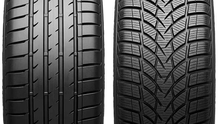 Close-up comparison of summer tire tread with wide straight water channels next to an all-season tread covered in fine sipes