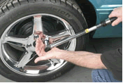 Careful wheel and tire installation with proper tools and torque wrench