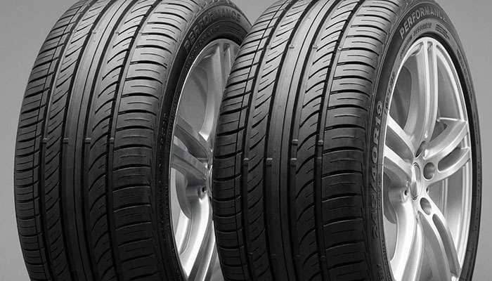 Close-up view of vehicle wheels with tires mounted, showcasing tread patterns and rims