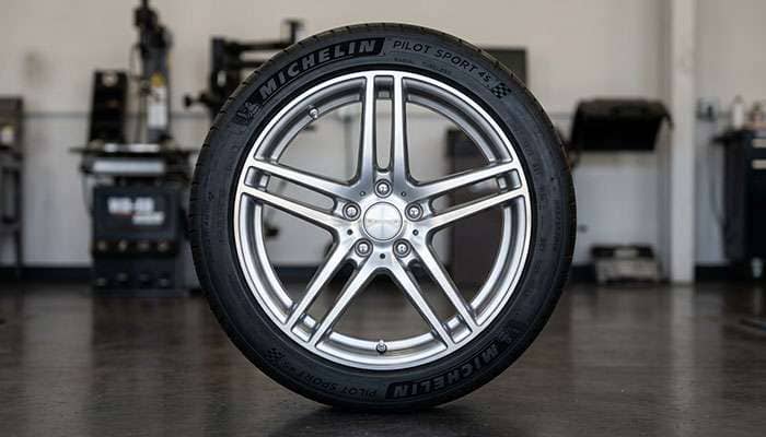 Tire bead properly seated on alloy wheel rim showing bead seat contact area