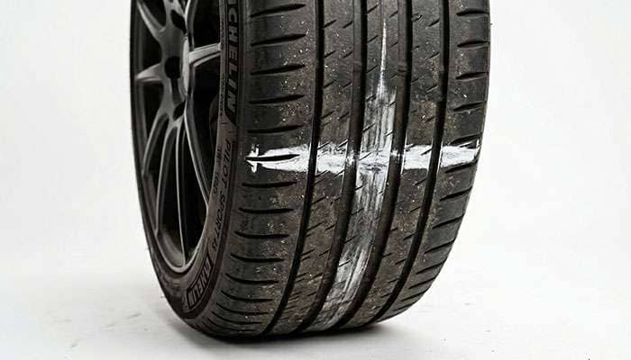 Chalk line across a tire tread for the chalk test to dial in pressure