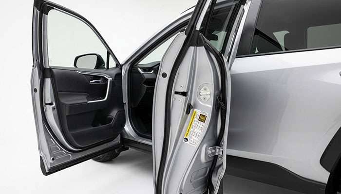 Vehicle driver door jamb showing the tire information placard with size and cold inflation pressure