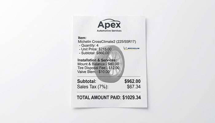 Receipt showing the cost breakdown for four Michelin CrossClimate2 tires including fees, taxes, and installation totaling $1,217.06