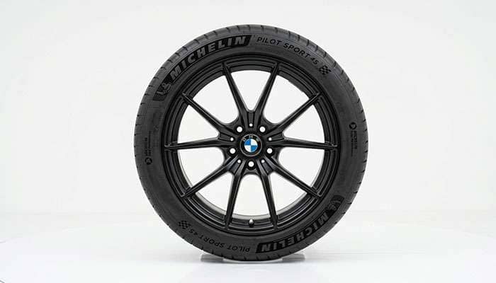 Side profile of a tire showing the sidewall bulging out to its widest section width point