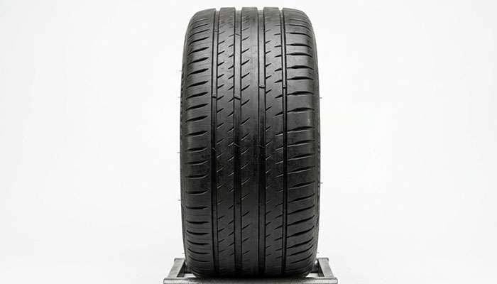 Straight-on view of a performance tire tread face showing the contact patch width
