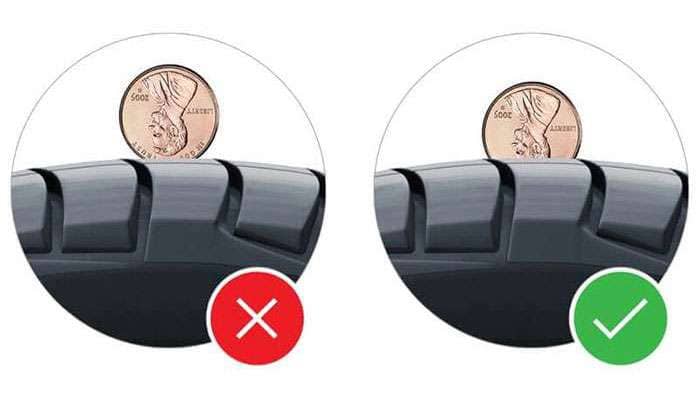 Tire tread depth check using a penny shows when to replace tires: left side too worn, right side safe to use