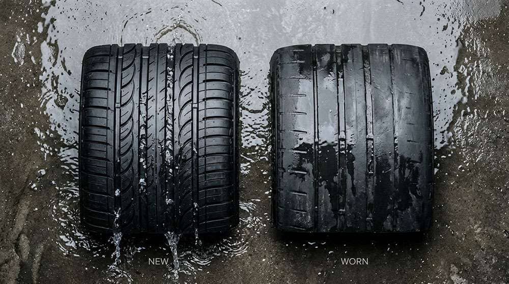 side by side comparison of new tire tread with full grooves versus worn tire tread showing dramatically reduced water evacuation channels