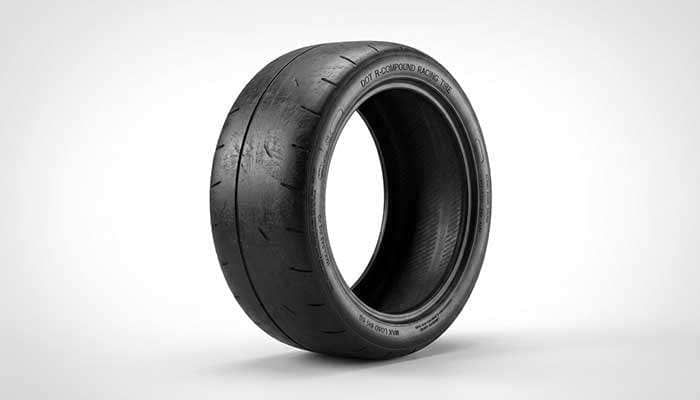Track tire showing minimal tread and soft racing compound