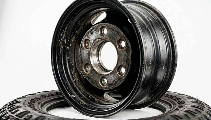 Close-up of the back of a pickup truck wheel showing the bolt holes and center bore