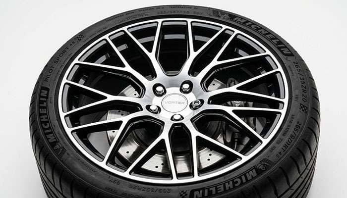 Two-tone alloy wheel with gloss black spokes and machined bright aluminum face