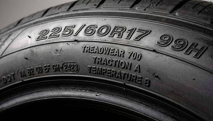 UTQG sidewall stamp detail showing treadwear traction temperature ratings