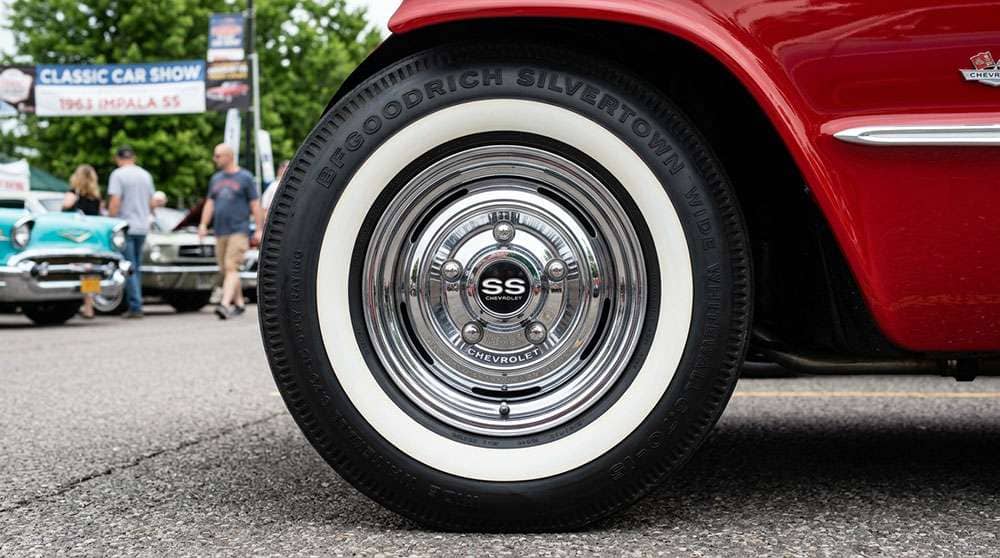 Authentic whitewall tires on restored 1960s classic car showing proper vintage tire fitment and sidewall appearance