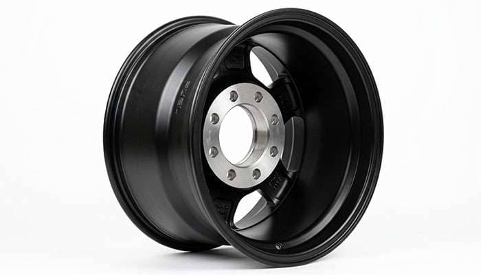 Rear view of a truck wheel showing the mounting pad, rim centerline, and backspacing measurement