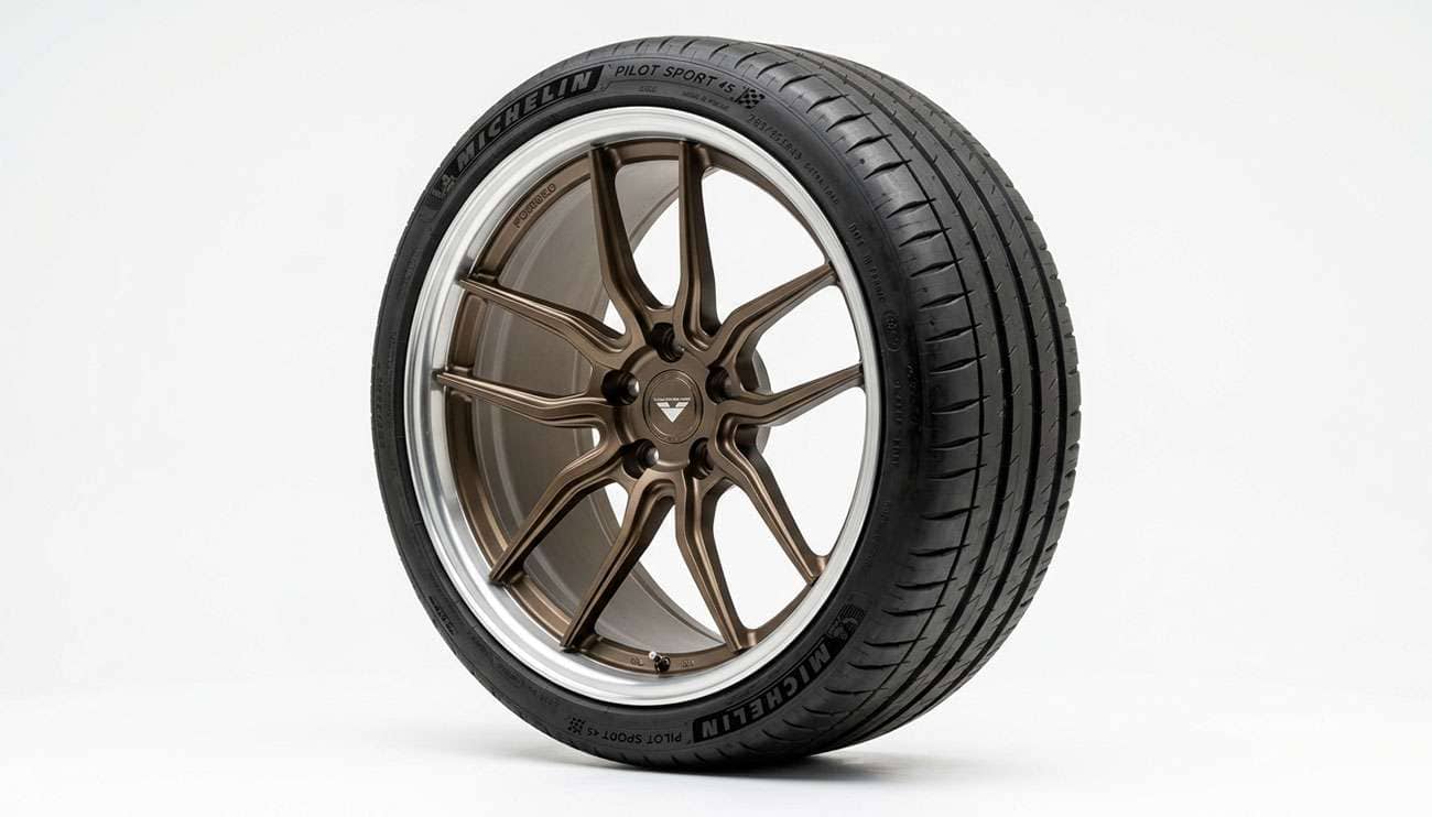 Aftermarket wheel mounted on a vehicle showing offset position relative to the fender