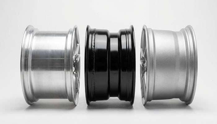 Comparison chart showing properties of various materials evaluated for wheel rim construction