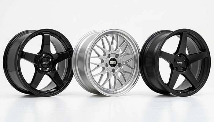Three aftermarket wheels in identical size showing flat face, mesh, and deep concave spoke profiles side by side
