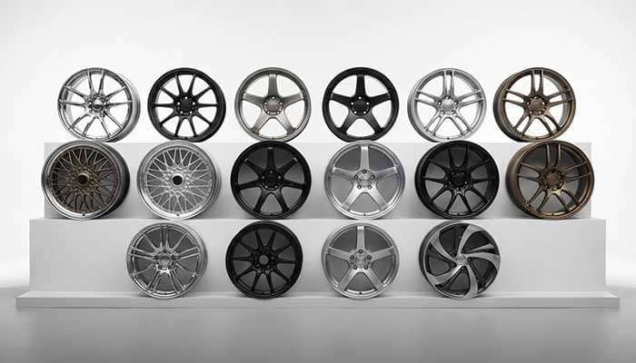Various car wheel rims displayed with performance tips on wheel weight, design, weather use, and drive systems