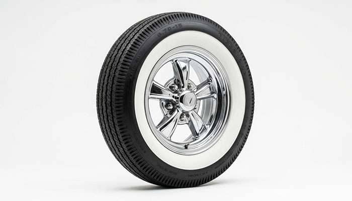 Whitewall tire showing black tread and white sidewall band