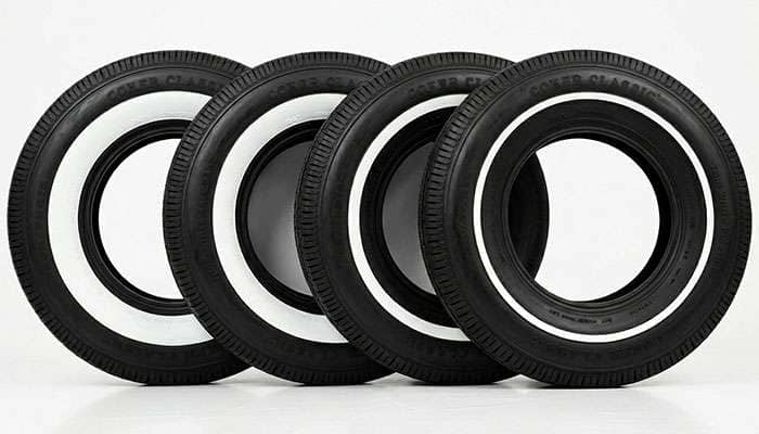 Five whitewall tires arranged left to right showing the shrinking whitewall width from 4 inches in the 1930s to pinstripe in the 1970s