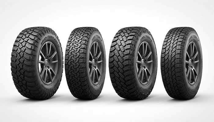 Comparison of wide versus narrow off-road tires showing four tires side by side