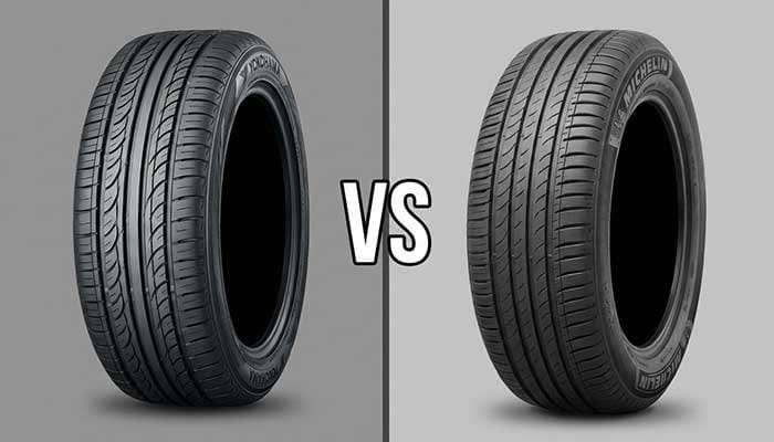Yokohama tire on red background versus Michelin tire on gray background with VS in center