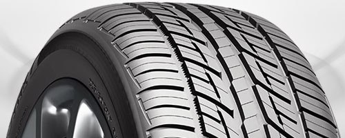 Performance tire with wide contact patch and specialized tread for enhanced grip and handling