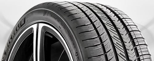 Run-flat tire cross-section showing reinforced sidewall construction for continued driving after puncture