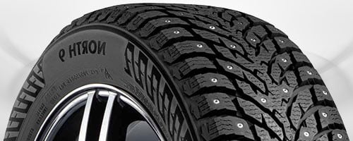 Winter truck tire with aggressive tread pattern designed for heavy loads and severe cold weather