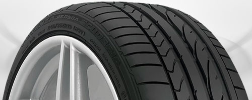 Summer tire with shallow tread depth and large contact blocks optimized for warm weather performance