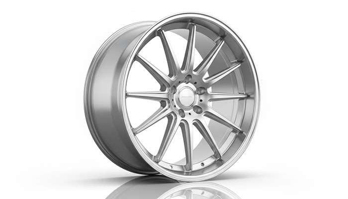 Modern alloy wheel featuring intricate spoke design with polished metallic finish